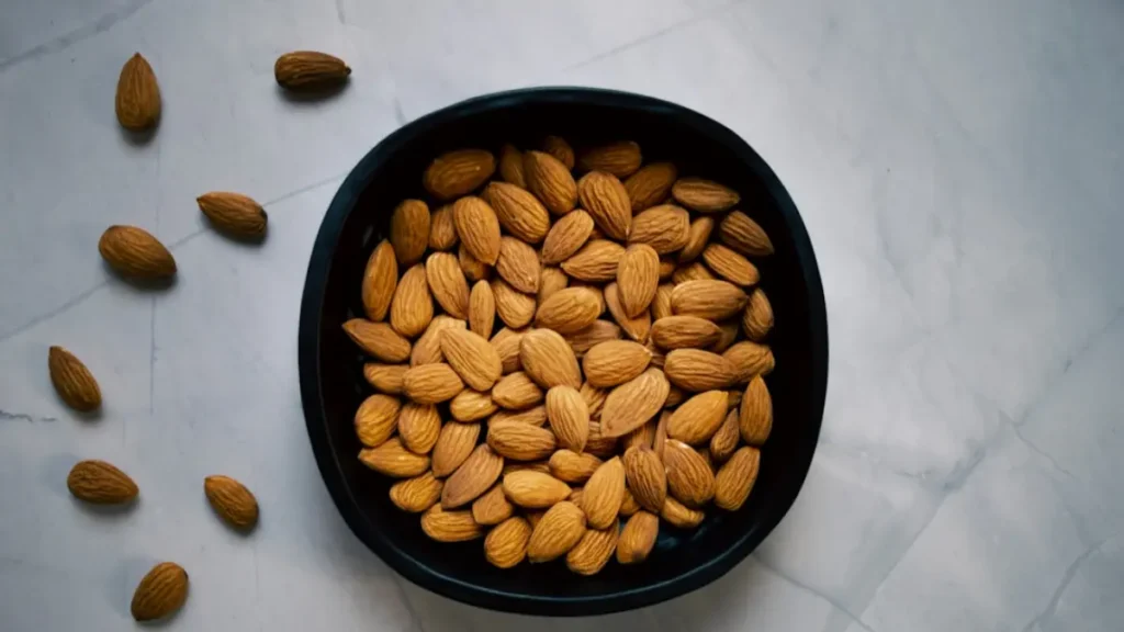 Bowl of almonds and walnuts – healthy nuts that support liver health